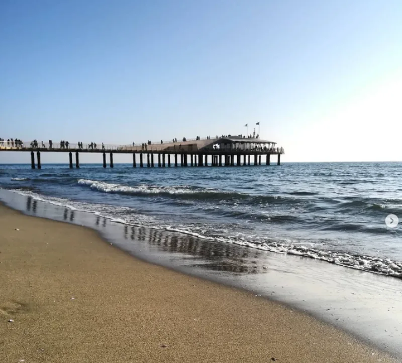 Pontile di Lido di Camaiore Italy yellow sand and blue water