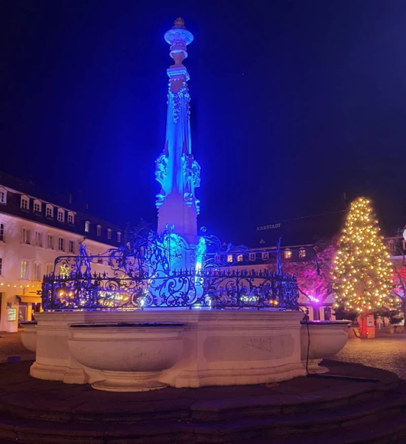 Saarbr&uuml;cken St. Johanner Markt Germany iluminated statue in the evening
