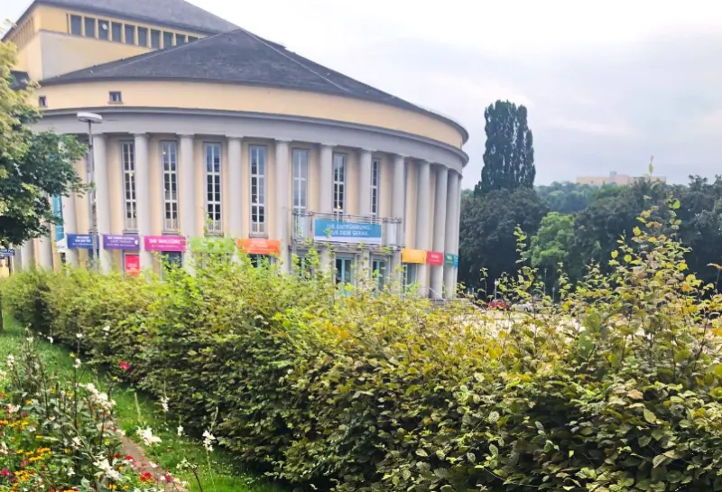 Saarl&auml;ndisches Staatstheater germany yellow and black building under white sky