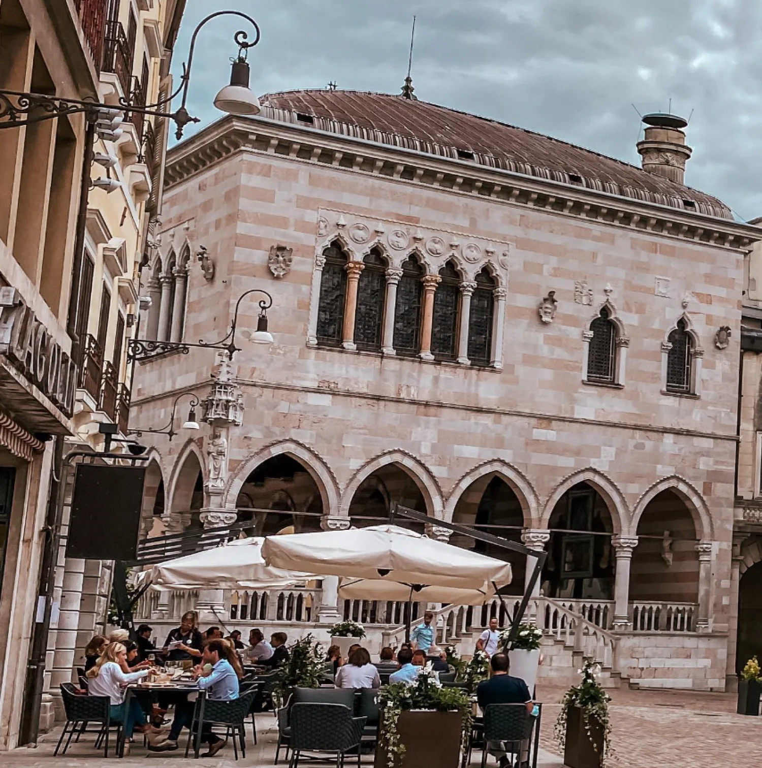 Udine italy Via Mercatovecchio people eating